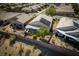 Home with solar panels, covered patio, and beautifully landscaped backyard at 2486 Divine Sky Dr, Henderson, NV 89044
