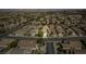 Wide aerial shot of a residential area displaying homes with varied designs, set against a backdrop of desert terrain at 2486 Divine Sky Dr, Henderson, NV 89044