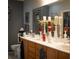 Bathroom featuring double sinks, framed mirrors, and an elegant decor at 2486 Divine Sky Dr, Henderson, NV 89044