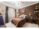 Comfortable bedroom with plush bedding, and side tables with lamps at 2486 Divine Sky Dr, Henderson, NV 89044