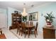 Traditional dining room with chandelier, wooden table, and display cabinet at 2486 Divine Sky Dr, Henderson, NV 89044