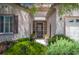 Charming home entrance with gated courtyard and lush landscaping at 2486 Divine Sky Dr, Henderson, NV 89044