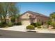 Charming single-story home featuring a well-maintained lawn and a two-car garage at 2486 Divine Sky Dr, Henderson, NV 89044