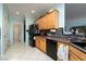 Stylish kitchen features black appliances and neutral countertop at 2486 Divine Sky Dr, Henderson, NV 89044