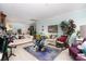 Bright and airy living room featuring a large window and lots of comfortable seating at 2486 Divine Sky Dr, Henderson, NV 89044