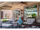 Inviting covered patio with comfortable seating, perfect for outdoor relaxation and gatherings at 2486 Divine Sky Dr, Henderson, NV 89044