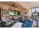 Inviting covered patio with comfortable seating and elegant decor, perfect for outdoor relaxation at 2486 Divine Sky Dr, Henderson, NV 89044
