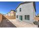 Spacious backyard with fresh dirt, block wall fencing, covered patio area and central air unit at 2634 Begonia Falls Ave # 38, North Las Vegas, NV 89081