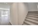 Inviting hallway with carpeted stairs leading to the upper level, connecting living spaces at 2634 Begonia Falls Ave # 38, North Las Vegas, NV 89081