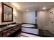 Bathroom features a soaking tub, glass-enclosed shower, and modern fixtures at 2700 Las Vegas Blvd # 1804, Las Vegas, NV 89109