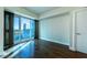 Bedroom with hardwood floors and large windows providing city views and natural light at 2700 Las Vegas Blvd # 1804, Las Vegas, NV 89109