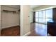 Walk-in closet featuring wood floors, built-in shelving, and ample storage space at 2700 Las Vegas Blvd # 1804, Las Vegas, NV 89109