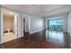 Open-concept living area with hardwood floors, balcony access, and a view of the bathroom at 2700 Las Vegas Blvd # 1804, Las Vegas, NV 89109