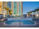 Beautiful rooftop pool with palm trees and city views at 2700 Las Vegas Blvd # 1804, Las Vegas, NV 89109