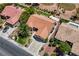 Aerial view of a well-manicured home showcasing a desert landscape, spacious driveway, and tile roof at 2808 Crown Ridge Dr, Las Vegas, NV 89134