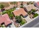 Aerial view of a single-Gathering home featuring a terra cotta tile roof, mature landscaping, and proximity to a golf course at 2808 Crown Ridge Dr, Las Vegas, NV 89134