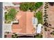 Expansive aerial view of a single-story home featuring a tile roof and lush landscaping, creating a serene outdoor setting at 2808 Crown Ridge Dr, Las Vegas, NV 89134