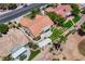 This aerial view showcases a well-maintained home with landscaped backyard, patio, and orange tile roof at 2808 Crown Ridge Dr, Las Vegas, NV 89134