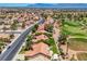 Wide aerial shot of homes adjacent to a golf course highlighting the well-manicured landscaping at 2808 Crown Ridge Dr, Las Vegas, NV 89134