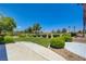 Private backyard with lush green landscaping and a view of the golf course at 2808 Crown Ridge Dr, Las Vegas, NV 89134