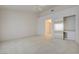 Open bedroom with closet featuring mirrored doors, ceiling fan, and neutral colored carpet at 2808 Crown Ridge Dr, Las Vegas, NV 89134