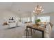 Bright and spacious dining room features neutral paint, views to the backyard and is open to the living room at 2808 Crown Ridge Dr, Las Vegas, NV 89134
