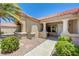Warm and welcoming front porch with decorative columns and manicured shrubs at 2808 Crown Ridge Dr, Las Vegas, NV 89134