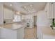 Functional kitchen with white cabinets, updated appliances, and recessed lighting at 2808 Crown Ridge Dr, Las Vegas, NV 89134