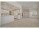 Open floorplan connecting the kitchen and living room offers natural light and ample living space at 2808 Crown Ridge Dr, Las Vegas, NV 89134