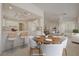This light and bright kitchen offers an open design with counter seating and white cabinetry at 2808 Crown Ridge Dr, Las Vegas, NV 89134