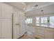 Well-lit kitchen with white cabinetry and tile flooring is conveniently located to a sitting area at 2808 Crown Ridge Dr, Las Vegas, NV 89134