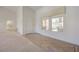 View of a living room featuring tile entry, high ceilings, and a glimpse of the kitchen at 2808 Crown Ridge Dr, Las Vegas, NV 89134