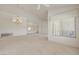 Large living area features an elegant chandelier and generous windows for natural light at 2808 Crown Ridge Dr, Las Vegas, NV 89134