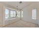 Bright living room features a bay window and neutral carpet at 2808 Crown Ridge Dr, Las Vegas, NV 89134