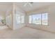 Bright, airy living room with large windows offering backyard views and ample natural light at 2808 Crown Ridge Dr, Las Vegas, NV 89134