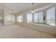 Bright living area with neutral carpet, large windows, and a view to the back patio at 2808 Crown Ridge Dr, Las Vegas, NV 89134