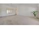 Bright living room with neutral carpet, high ceilings and view of front yard at 2808 Crown Ridge Dr, Las Vegas, NV 89134