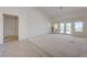 Bright living room with vaulted ceilings, neutral carpet, and french doors to the backyard at 2808 Crown Ridge Dr, Las Vegas, NV 89134