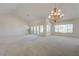 Bright, airy living room featuring vaulted ceilings and french doors to a patio at 2808 Crown Ridge Dr, Las Vegas, NV 89134