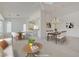 This spacious living and dining room features an open floorplan and neutral paint, great for entertaining at 2808 Crown Ridge Dr, Las Vegas, NV 89134