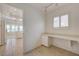 Bright office features a built-in desk, storage, and tile flooring connected to the kitchen area at 2808 Crown Ridge Dr, Las Vegas, NV 89134