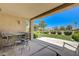 Relax on this covered patio with a view of the lush green landscaping and golf course at 2808 Crown Ridge Dr, Las Vegas, NV 89134