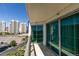 Balcony view showcases city buildings and lush palm trees at 322 Karen Ave # 1106, Las Vegas, NV 89109
