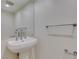 Bathroom vanity with white sink, chrome faucet, and decorative chrome towel rack at 322 Karen Ave # 1106, Las Vegas, NV 89109