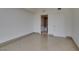 Bright bedroom with tile flooring and a bathroom in view at 322 Karen Ave # 1106, Las Vegas, NV 89109