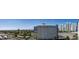 Expansive city view showcases tall buildings, a golf course, and nearby mountains at 322 Karen Ave # 1106, Las Vegas, NV 89109