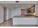 Modern kitchen with granite countertops, light wood cabinets, and stainless steel microwave at 322 Karen Ave # 1106, Las Vegas, NV 89109