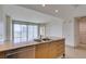 Kitchen island with stainless steel dishwasher, double sink, and granite counter at 322 Karen Ave # 1106, Las Vegas, NV 89109