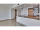A modern kitchen featuring granite countertops, wood cabinets, and stainless steel appliances at 322 Karen Ave # 1106, Las Vegas, NV 89109