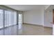 Bright open living room with balcony access and tile floors at 322 Karen Ave # 1106, Las Vegas, NV 89109